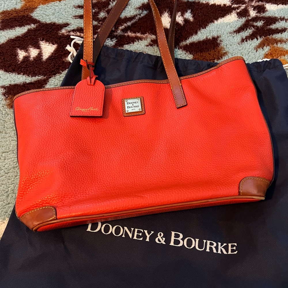 Dooney and Bourke purse. Medium Lexington. Geranium. Very good used condition.